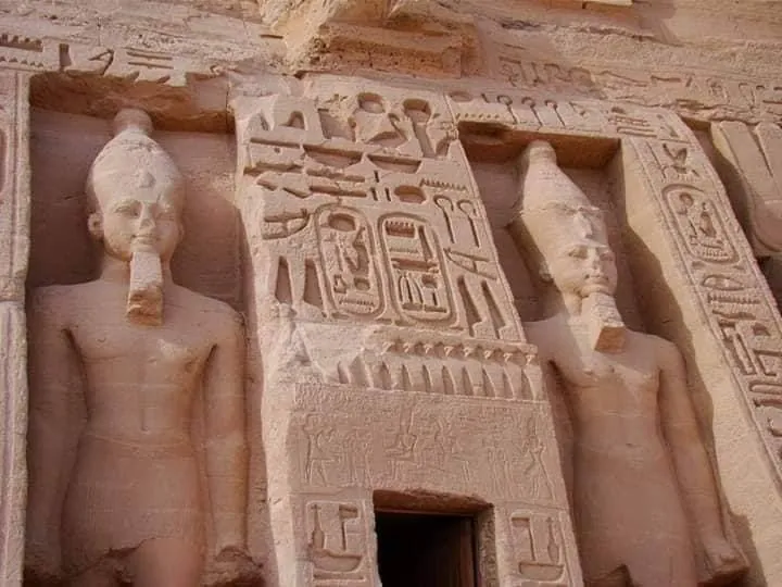 Carved standing statues on the façade of a temple at Abu Simbel