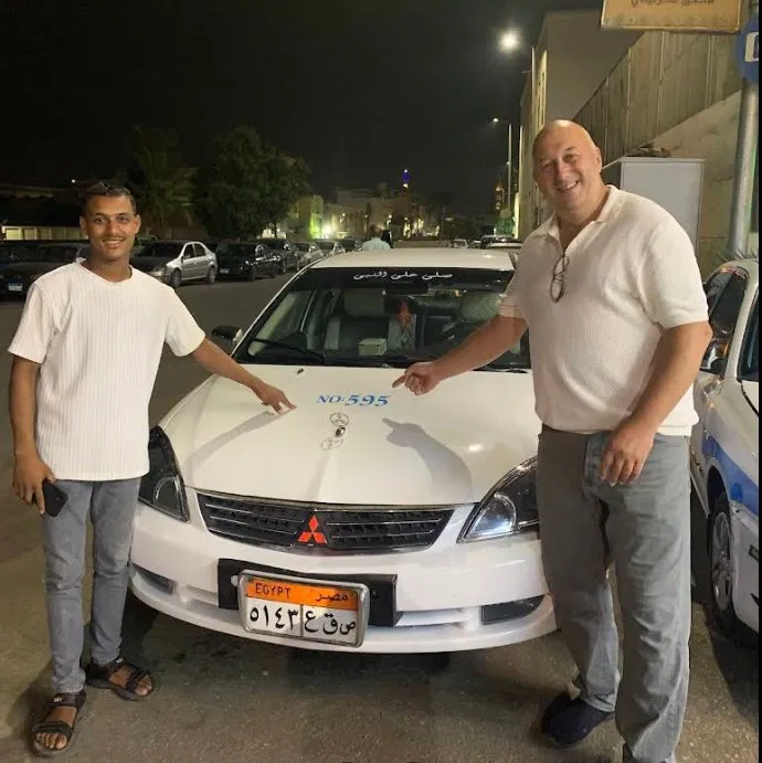 Private driver waiting at Luxor Airport at night