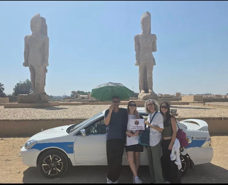 Tourists with Tito's taxi at Colossi of Memnon