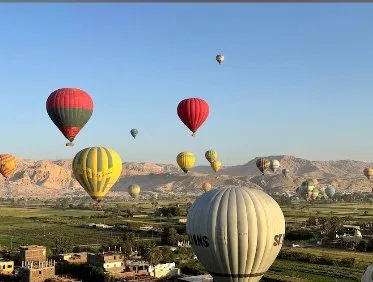 Hot air balloons over Luxor at sunrise