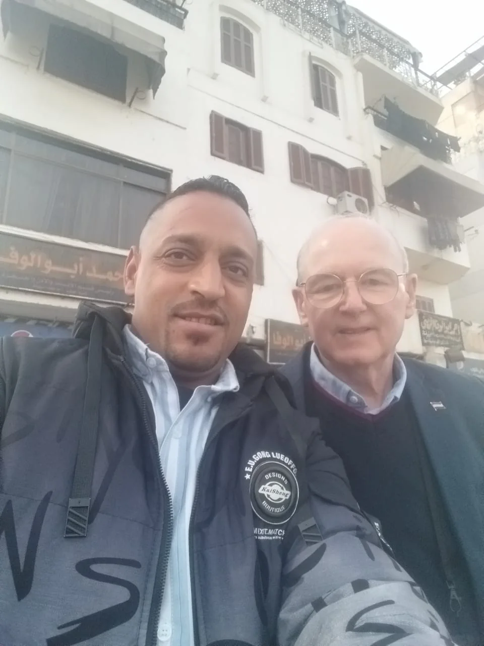 Tito with a guest on a city street